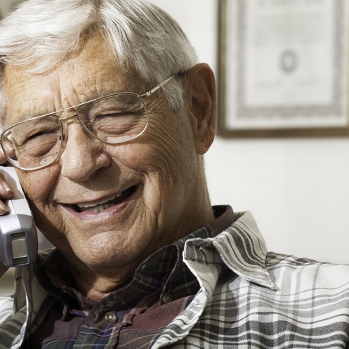 Senior man talking on telephone