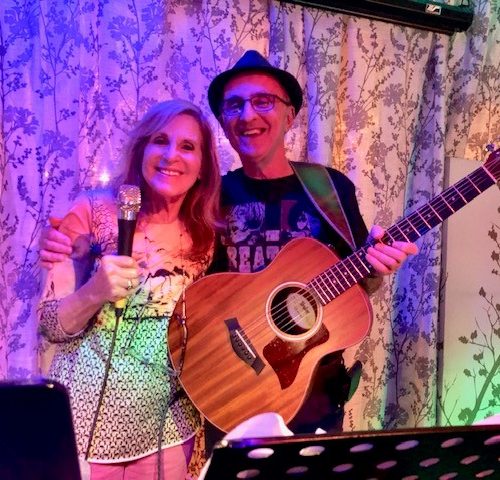 Client Gail and her husband Michael performing at an open mic night